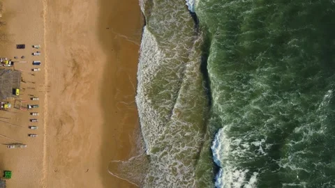 Aerial top down drone shot of ocean tides, big ocean tides at beach Stock Footage 296674655