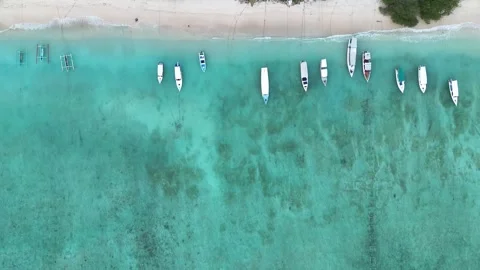 Aerial Top Down Drone Sliding Over Gili Meno Turquoise Sea Revealing Beach Stock-Footage 330976794