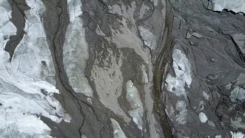 Aerial top down drone view of ice and rocks frozen lake and river 4k Stock Footage 102757220