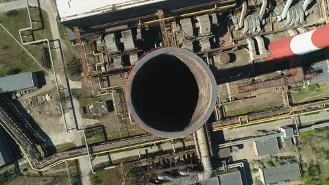 Aerial top down drone view of large red and white chimney without smoke at sunny Stock Footage 129972392