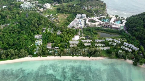 Aerial top down drone view of coral reef sea panning up towards hotels 4k Stock Footage 257192696