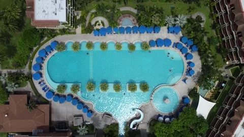 Aerial top down drone view of 5-star hotel swimming pool 4k Stock Footage 276409064