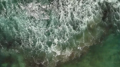Aerial top down drone view of sea waves crashing Stock Footage 278717088