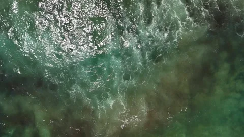 Aerial top down drone view of sea waves crashing Stock Footage 278717094