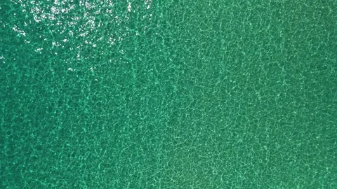 Aerial top down drone view of turquoise transparent sea water Stock Footage 278792651