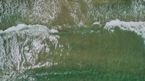 Aerial top down drone view of sea waves crashing Stock Footage 278794478