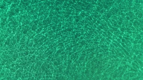 Aerial top down drone view of turquoise transparent sea water Stock Footage 279582011