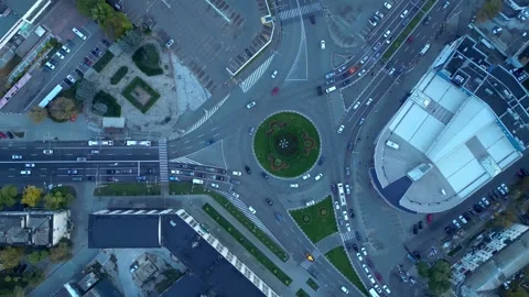 Aerial top down drone view of city roundabout traffic in October Stock Footage 321311985