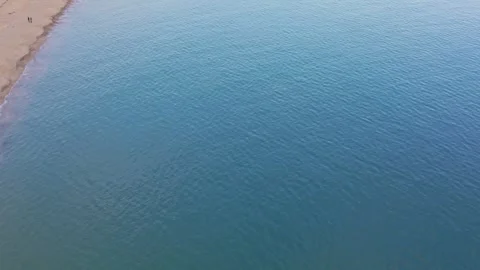 Aerial top-down drone view of calm blue sea surface Stock Footage 322902025