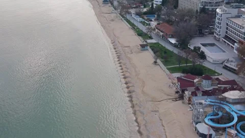 Aerial top-down drone view of concrete breakwater and green water Stock Footage 322902029