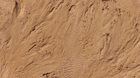Aerial Top Down Drone View of Sand Erosion and Mud Crack Textures in Desert Stock Footage 346493230