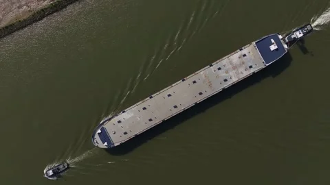 Aerial top down empty container cargo ship sailing calm river waters at sunlight Stock Footage 294168466