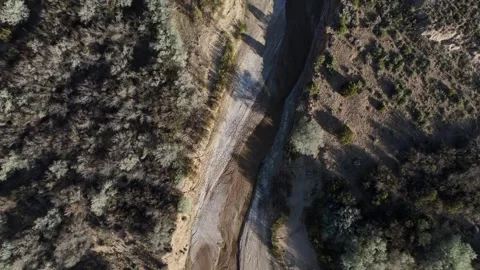 Aerial top down of empty dried up river bed on historic route 66 in Lupton .. Video stock 320740343