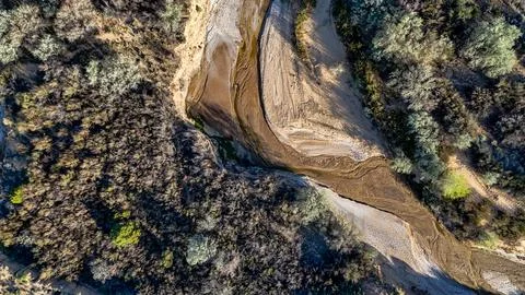 Aerial top down of empty dried up river bed on historic route 66 in Lupton .. Stock Photos