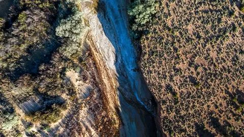 Aerial top down of empty dried up river bed on historic route 66 in Lupton .. Stock Photos