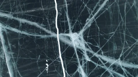 Aerial top down epic blue cracked ice frozen lake Baikal Russia landmark Stock Stock Footage 165664458