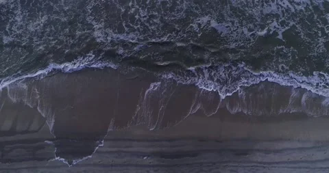 Aerial top down facing ground of beach and waves teal water coast Stock Footage 232028757