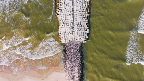 Aerial Top Down Flight Across Liepaja Harbor Breakwater And Shoreline Stock Footage 334332499