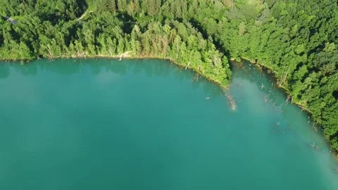 Aerial top down flight over amazing small lake of perfectly round shape. Stock Footage 204872801