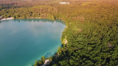 Aerial top down flight over amazing small lake of perfectly round shape. Stock Footage 204872815