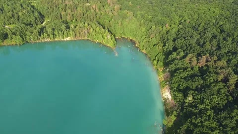 Aerial top down flight over amazing small lake of perfectly round shape. Stock Footage 204872855