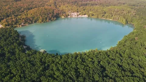 Aerial top down flight over amazing small lake of perfectly round shape. Stock Footage 204872870