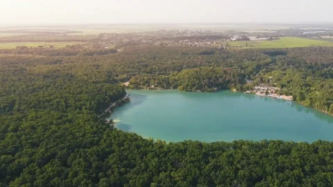 Aerial top down flight over amazing small lake of perfectly round shape. Stock Footage 204872964