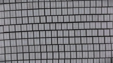 Aerial Top-Down Flying Over Rows of Precast Concrete Molds aligned in Pattern Stock Footage 303561552