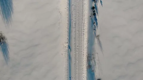 Aerial Top Down Flyover Shot Winter transport road in rural areas Stock Footage 171340201