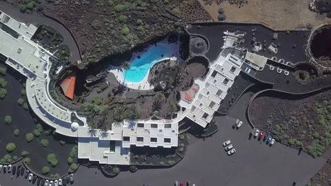 Aerial top down footage camera zoom out from the landscape housing on Lanzarote Stock Footage 85023028