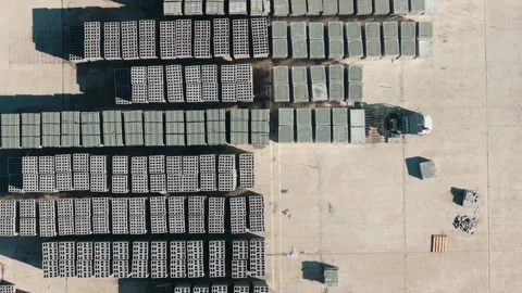Aerial Top Down Forklift and Truck Loading Concrete Blocks at Supply Yard Stock Footage 346751805