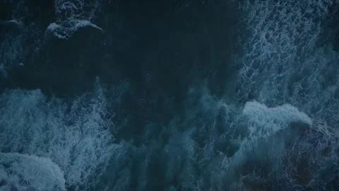 Aerial Top Down Forward Flight Over Ocean Waves Rolling Past Stock Footage 340285161