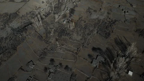 Aerial top-down forward landscape shot of remote Zarabod Village Hunza Valley Stock Footage 245474935