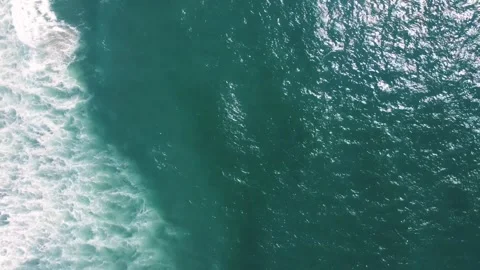 Aerial top down of Haystack Rock formation ocean on Cannon Beach Oregon Coa.. Видео 293510007