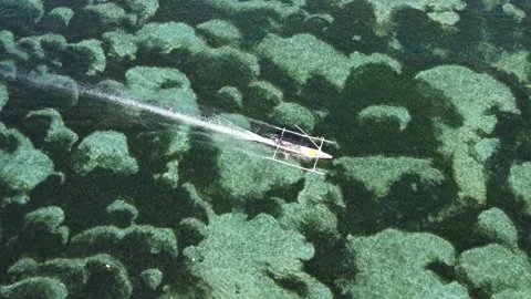 Aerial top down hover over Geger Beach water Stock Footage 329077486