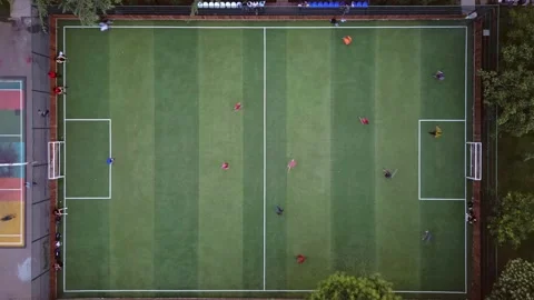 Aerial top down hyper lapse view two boys teams compete play football outsi.. Stock-Footage 278978855