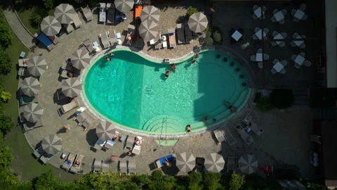 Aerial top down hyperlapse of a swimming pool with people bathing Stock Footage 248507871