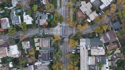 Aerial top-down hyperlapse tracking shot moving forward over a city street .. Video stock 339210491