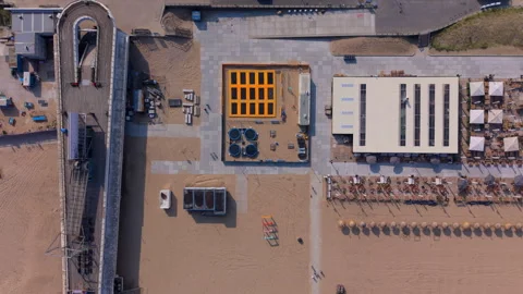 Aerial top down look view of a beach playground with trampolines next Stock Footage 339630494