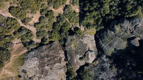 Aerial top down of Meteora cliff mountains rock formations winter day in Ka.. Video stock 314618116
