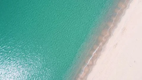 Aerial top down nature view of rocks and beach near the blue sea of Palamos.. 스톡 동영상 246294910