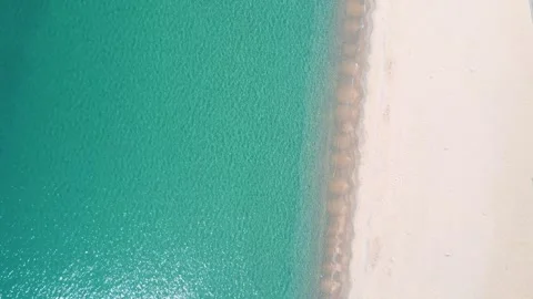 Aerial top down nature view of rocks and beach near the blue sea of Palamos.. 스톡 동영상 246294917
