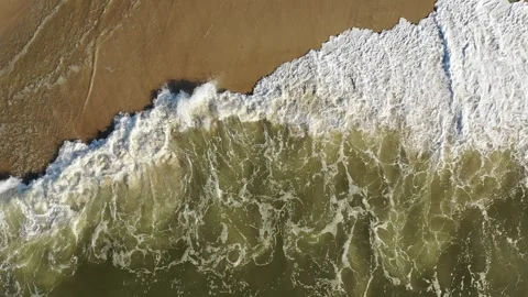 Aerial Top Down Ocean Waves Rolling Onto Sandy Beach Stock Footage 329197507