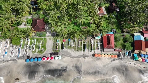 Aerial Top Down Pan Over Virgin Beach Bali Traditional Boats and Bungalow Stock-Footage 330978253