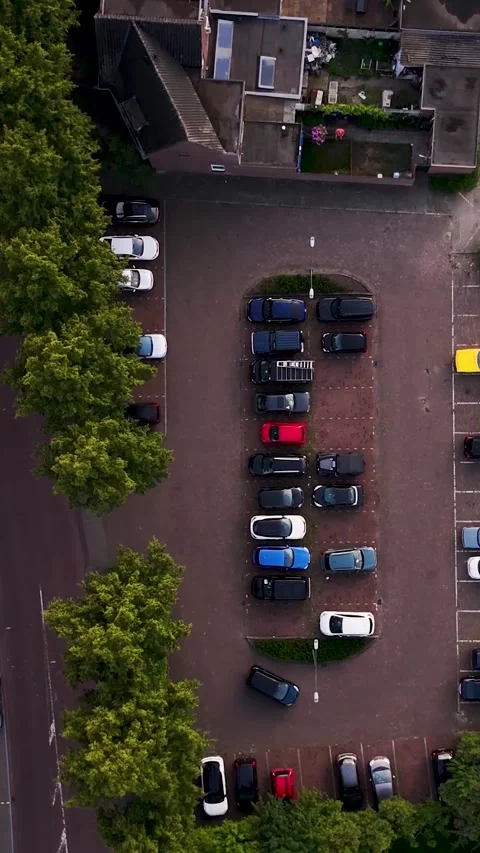 Aerial top down perspective of car parking Видео 336496505