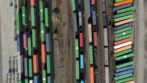 Aerial top down perspective flight over shipping containers at a railroad yard. Stock Footage 221536718