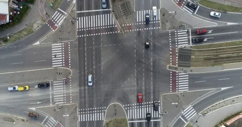 Aerial top down pull out shot of an intersection with traffic in the city Stock Footage 113043508