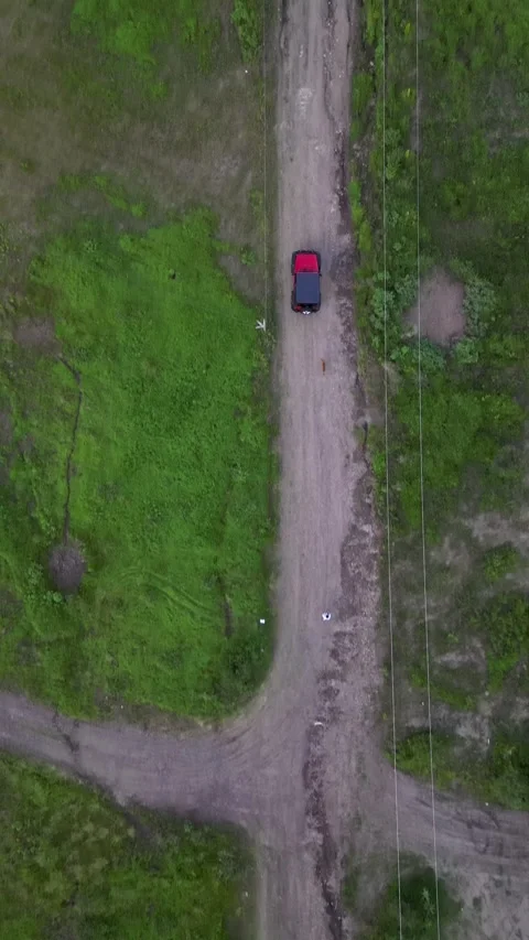 Aerial top down of a red car on dirt roads, central Mexico Stock Footage 341548235