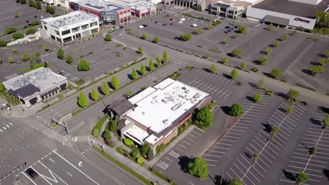 Aerial top down revealing empty parking at a shopping mall during coronavirus. Stock Footage 130479783