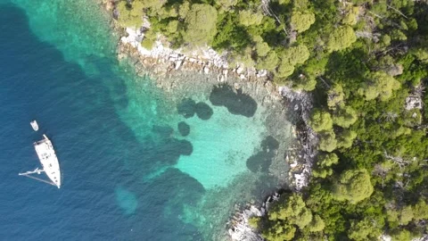 Aerial top-down rise over a sailing yacht close-up Stock Footage 336604276